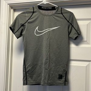 Medium, Nike shirt.